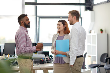 Image showing happy business team drinking coffee at office