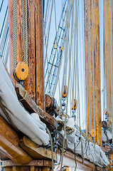 Image showing Folded sail and mast on an old sailboat