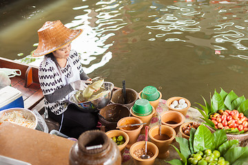 Image showing Thai woman preparing food