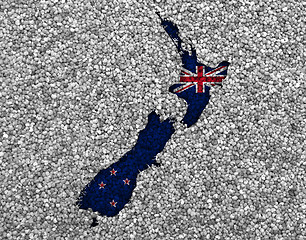 Image showing Map and flag of New Zealand on poppy seeds,