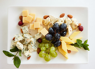 Image showing cheese variation on a white table.