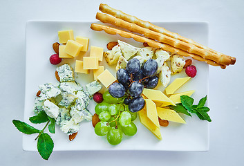 Image showing cheese variation on a white table.