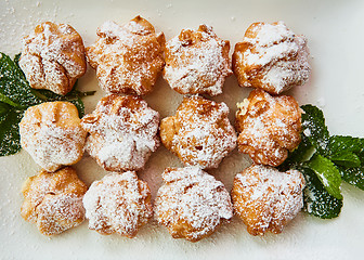 Image showing Fresh homemade profiteroles with cream pastry.