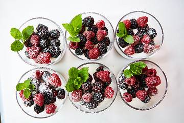 Image showing Blackberry and raspberry in the white yogurt.