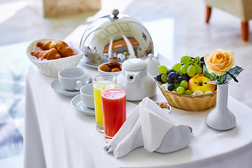 Image showing delicious breakfast for two at the luxury hotel.