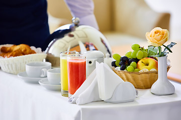 Image showing delicious breakfast for two at the luxury hotel.