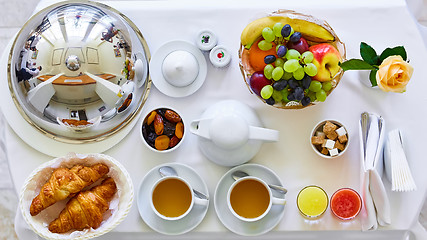 Image showing delicious breakfast for two at the luxury hotel.