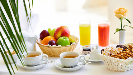 Image showing delicious breakfast for two at the luxury hotel.