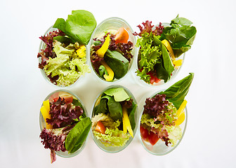 Image showing Beetroot salad with avocado and herring in cream sauce in a glass.