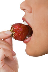 Image showing Biting into a strawberry