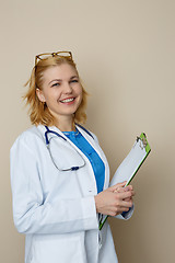 Image showing Young woman with green folder