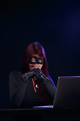 Image showing Night thief in black mask