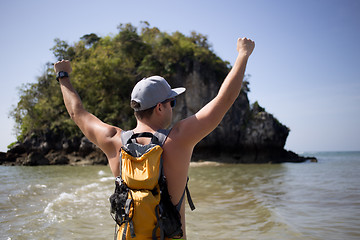 Image showing Guy standing back on coast