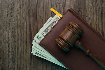 Image showing Judge\'s hammer, folder with banknotes