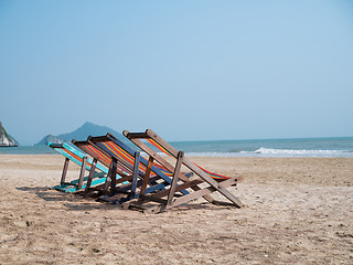 Image showing Sandy beach with deck chairs