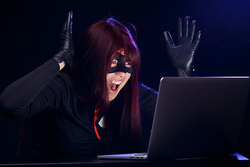 Image showing Surprised night thief in laptop