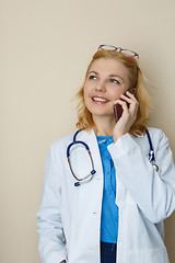 Image showing Blonde in robe with phone