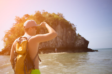 Image showing Man with backpack on seacoast