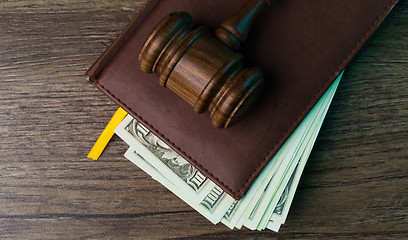 Image showing Judge\'s hammer, folder with dollars