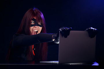 Image showing Girl in mask of thief