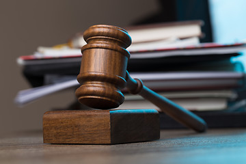 Image showing Hammer, paper lies on table