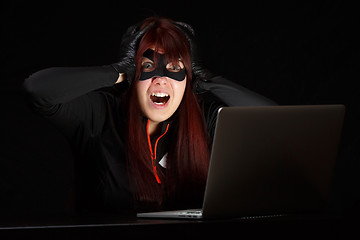 Image showing Woman steals information from computer