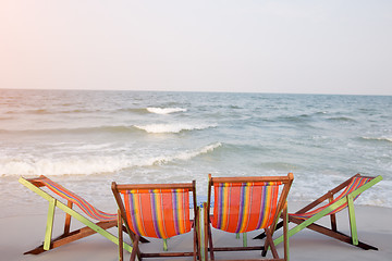 Image showing Two deck chairs on beach