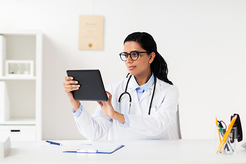 Image showing doctor with tablet pc and clipboard at hospital