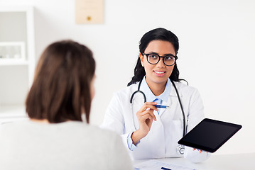 Image showing doctor with tablet pc and woman at hospital