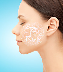 Image showing woman face with low poly grid projection on cheek