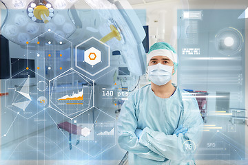 Image showing surgeon in operating room at hospital with charts