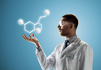 Image showing scientist in safety glasses with molecular formula