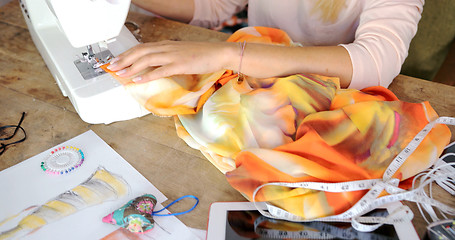 Image showing Crop female sewing