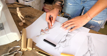 Image showing Tailor drawing sketches