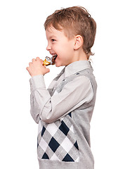 Image showing Boy eating chocolate