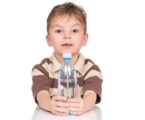 Image showing Boy with plastic bottle of water.