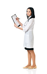 Image showing Female doctor holding clipboard