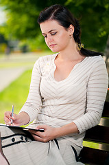 Image showing Business woman in summer park