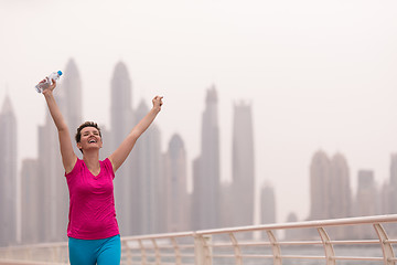 Image showing young woman celebrating a successful training run