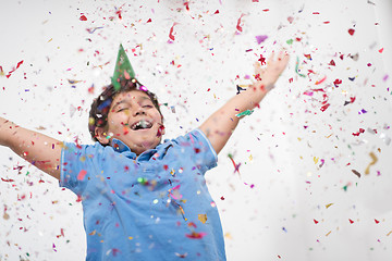 Image showing kid blowing confetti