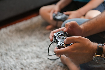 Image showing Happy family playing a video game