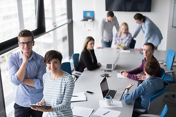 Image showing Two Business People Working With Tablet in office