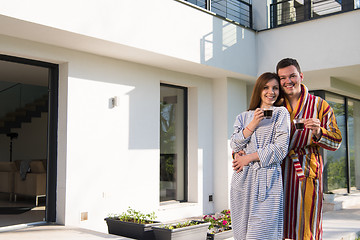 Image showing Young beautiful couple in bathrobes