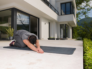 Image showing man doing morning yoga exercises