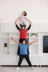 Image showing young boys posing line up piggyback