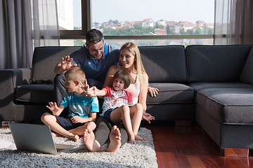 Image showing Family Playing Together with laptop computer