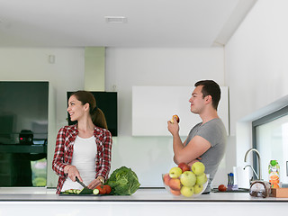 Image showing Young handsome couple in the kitchen