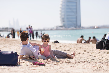 Image showing Mom and daughter on the beach