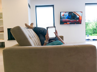 Image showing woman on sofa using tablet computer