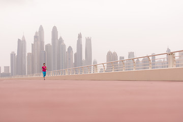 Image showing woman running on the promenade